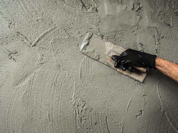 Hand,Worker,Plaster,Cement,Wall,Background,With,Hand,Holding,Work